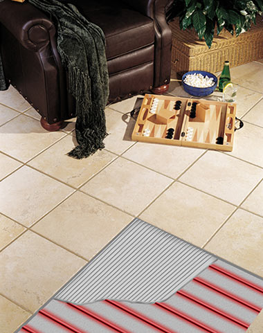 A tile floor with cutaway snowing the ComfortTile floor heating cable and thinset.